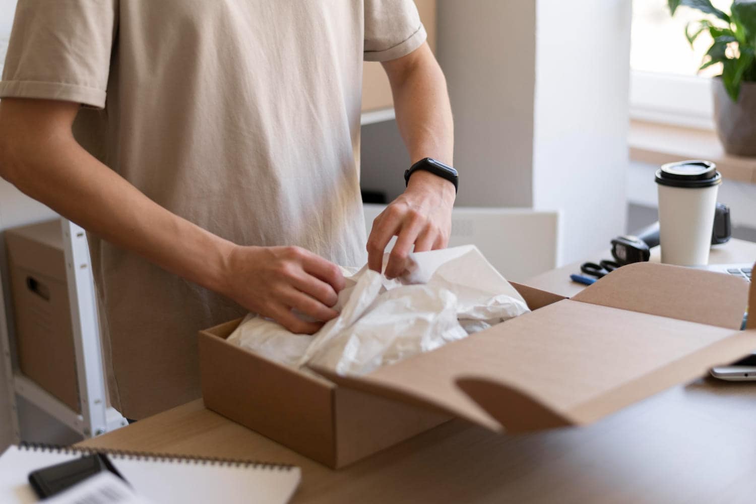 a person packing a parcel